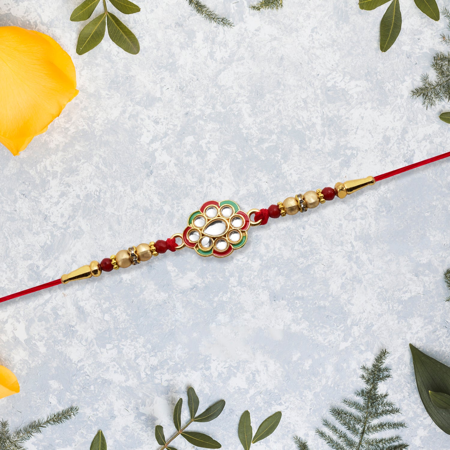 Kundan Work Floral Rakhi With Red Thread Kundan Work Floral Rakhi With Red Thread